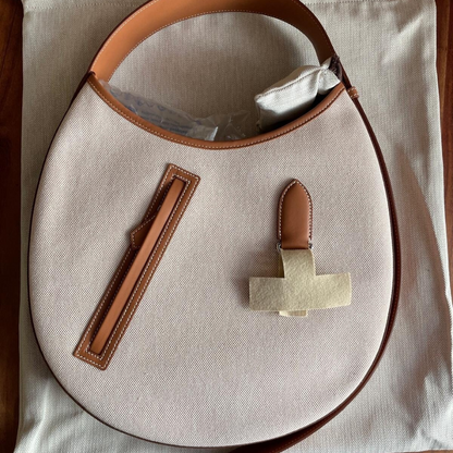 SMALL SADDLE BAG MADE OF FABRIC AND LEATHER BY HERMÈS
