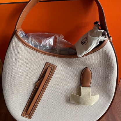 SMALL SADDLE BAG MADE OF FABRIC AND LEATHER BY HERMÈS