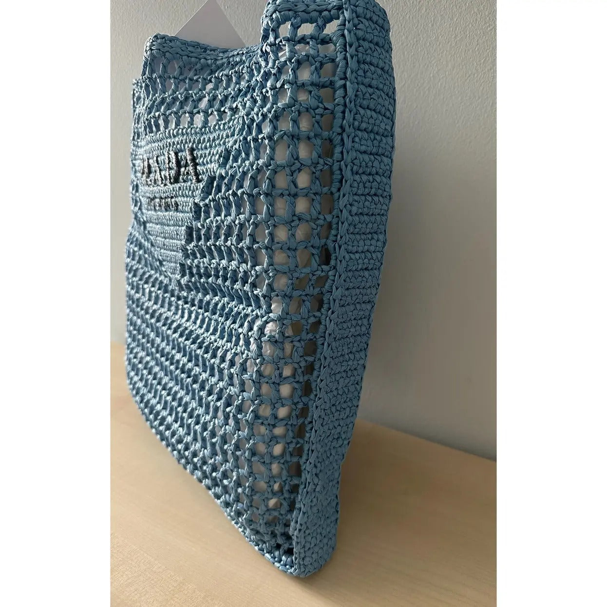 PRADA RAFFIA BAG WITH WOVEN LOGO IN BLUE